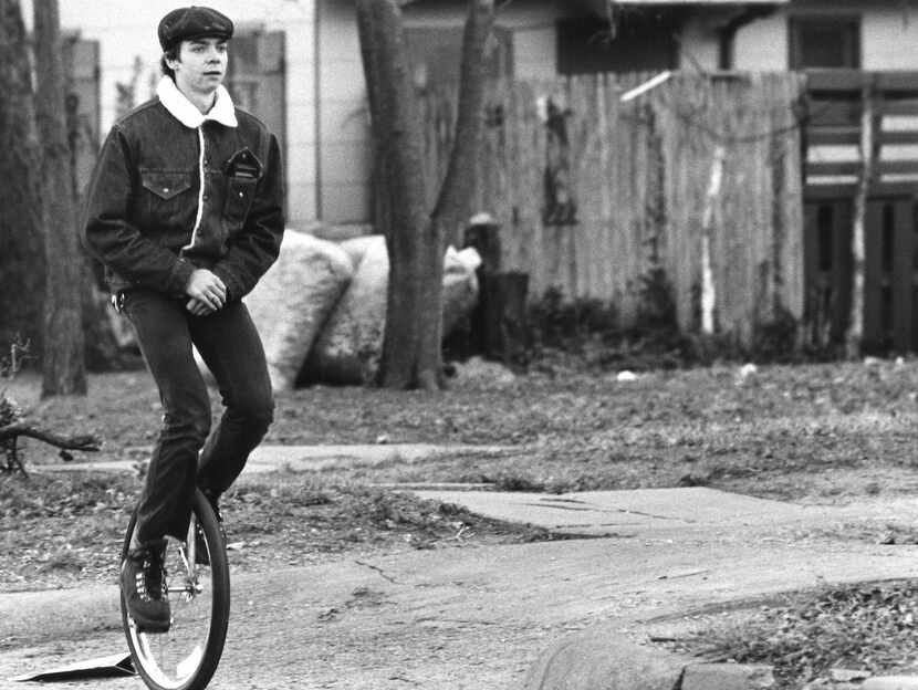 Bob Stone, 19, unicycles past Oak Cliff Park