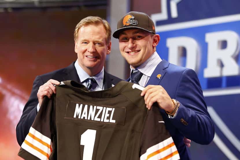 Johnny Manziel (Texas A&M) poses for photos with commissioner Roger Goodell after being...