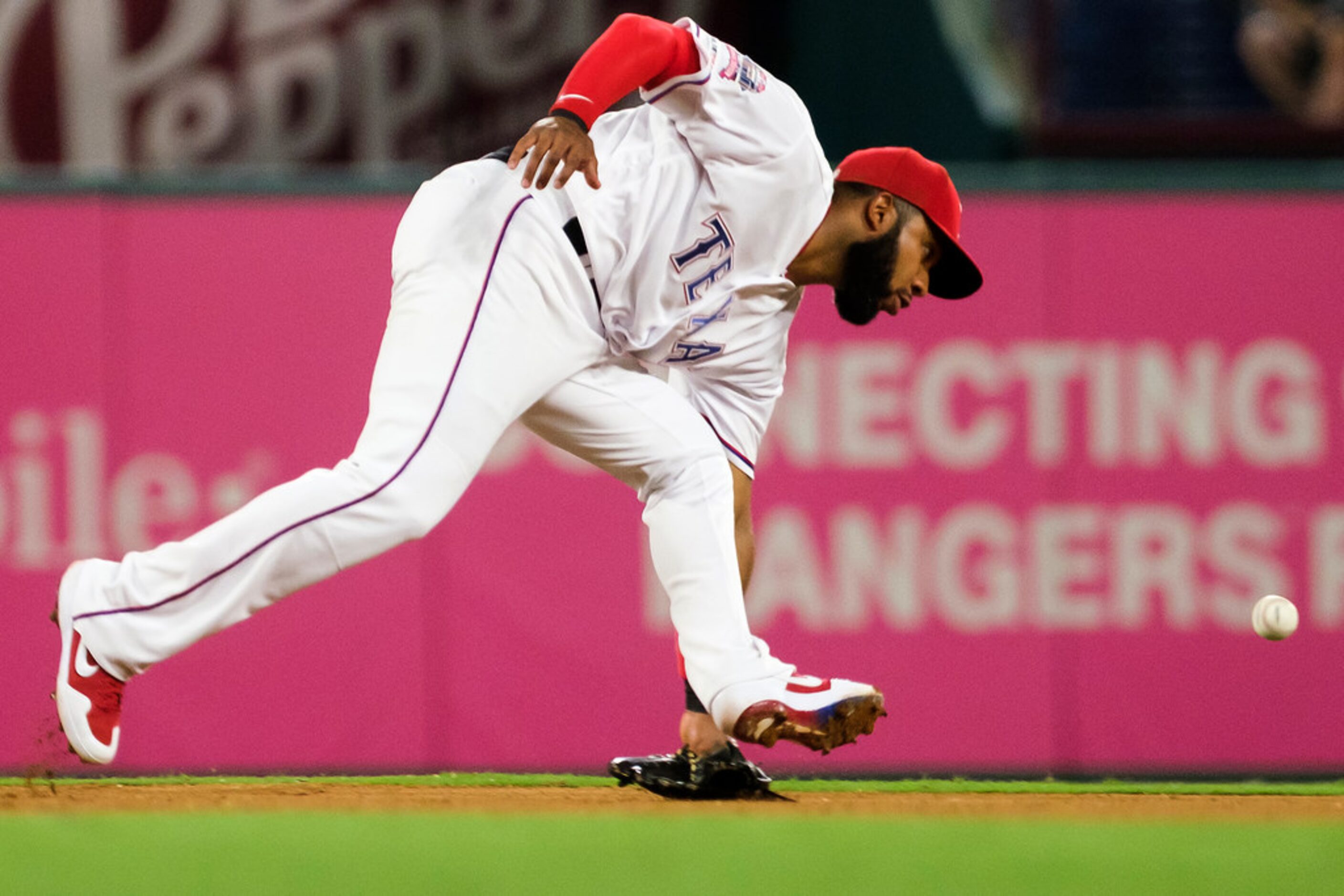 Texas Rangers shortstop Elvis Andrus (1) canÃt make the play on a single off the bat of...