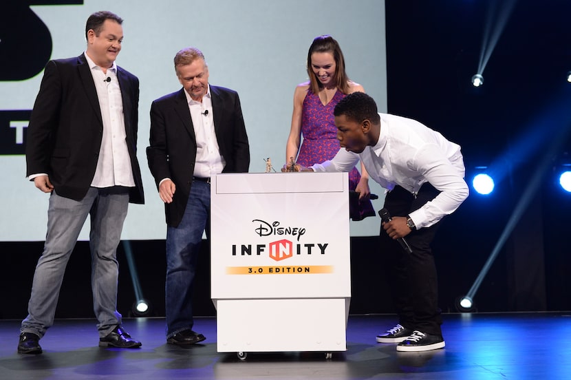 John Vignocchi (far left) watches as Star Wars: The Force Awakens stars Daisy Ridley and...