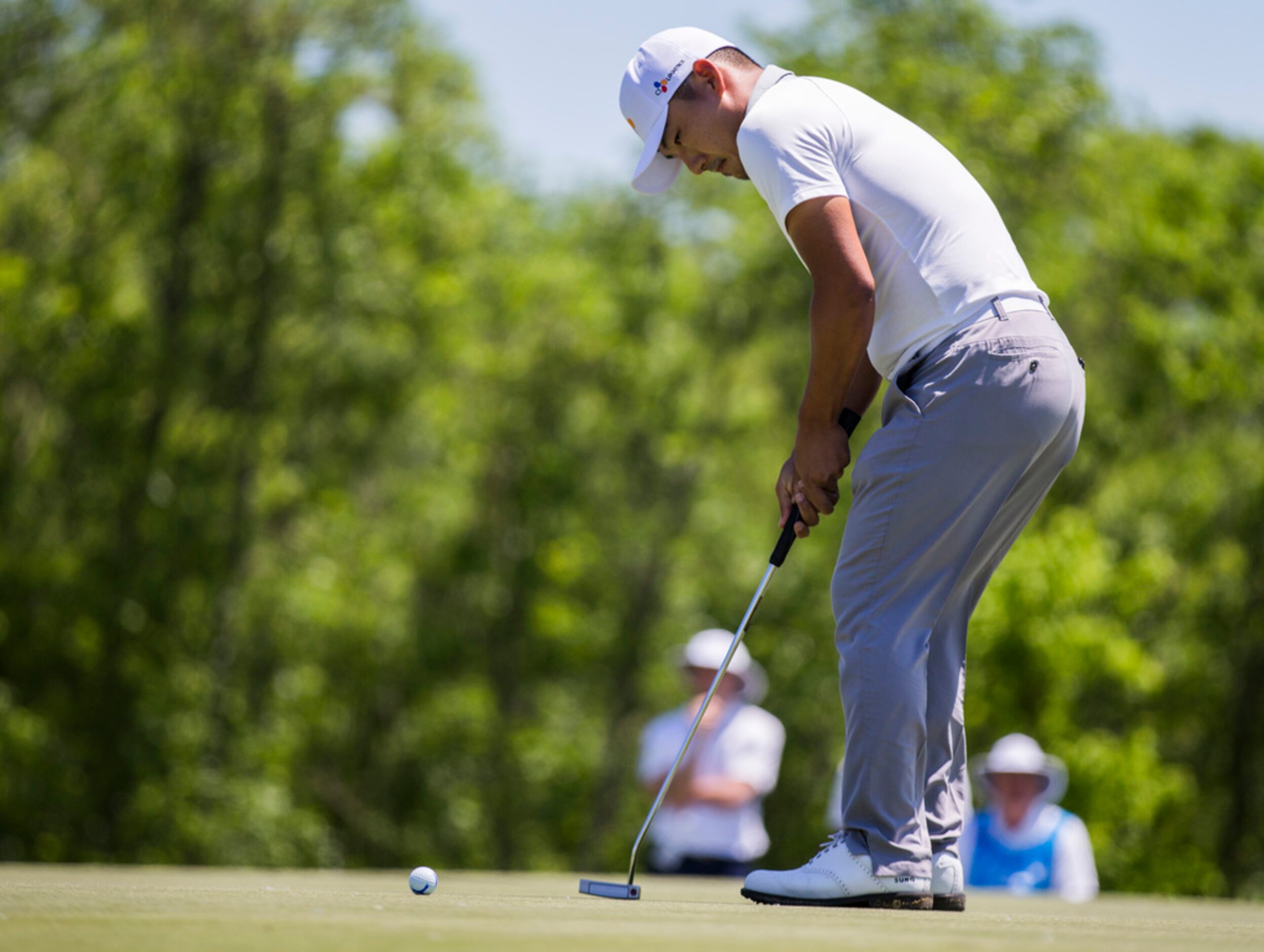 Sung Kang putts on the third green during round 4 of the AT&T Byron Nelson golf tournament...