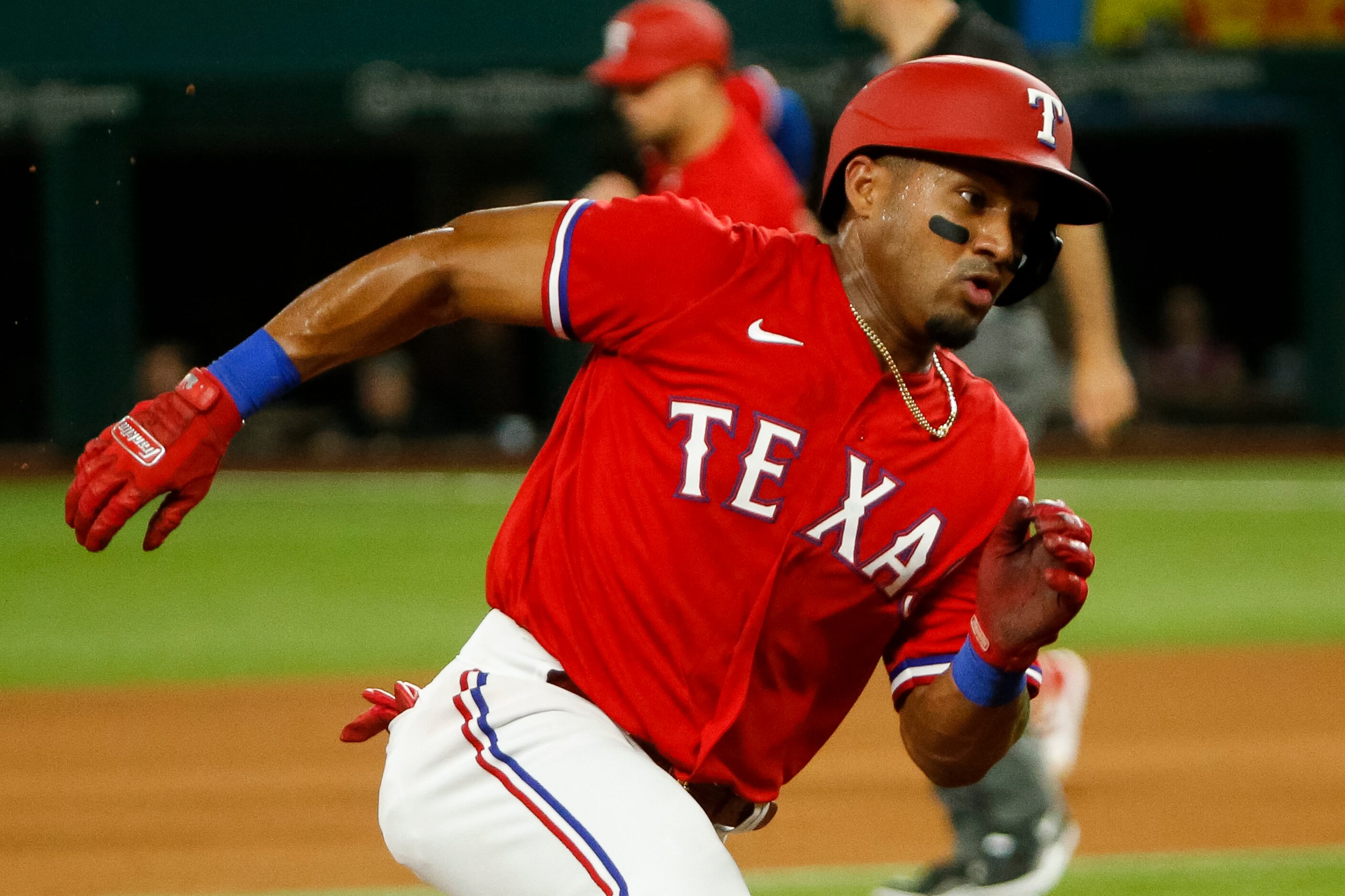 Texas Rangers designated hitter Andy Ibanez (77) runs to third base during the sixth inning...