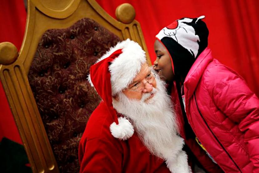 
Ky'liah Ware whispered a wish to Santa Claus. Families lined up in the early morning hours...