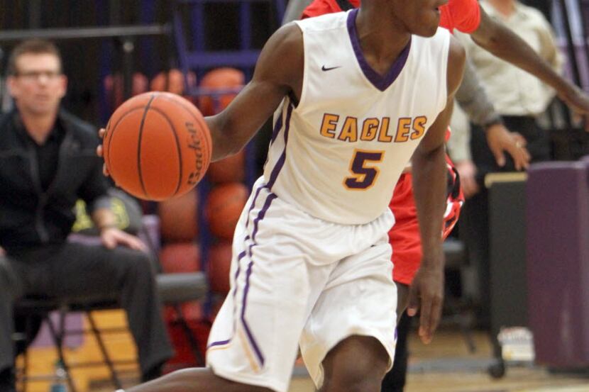 Richardson guard Brandon Averette (5) looks for a teammate in which to pass during second...