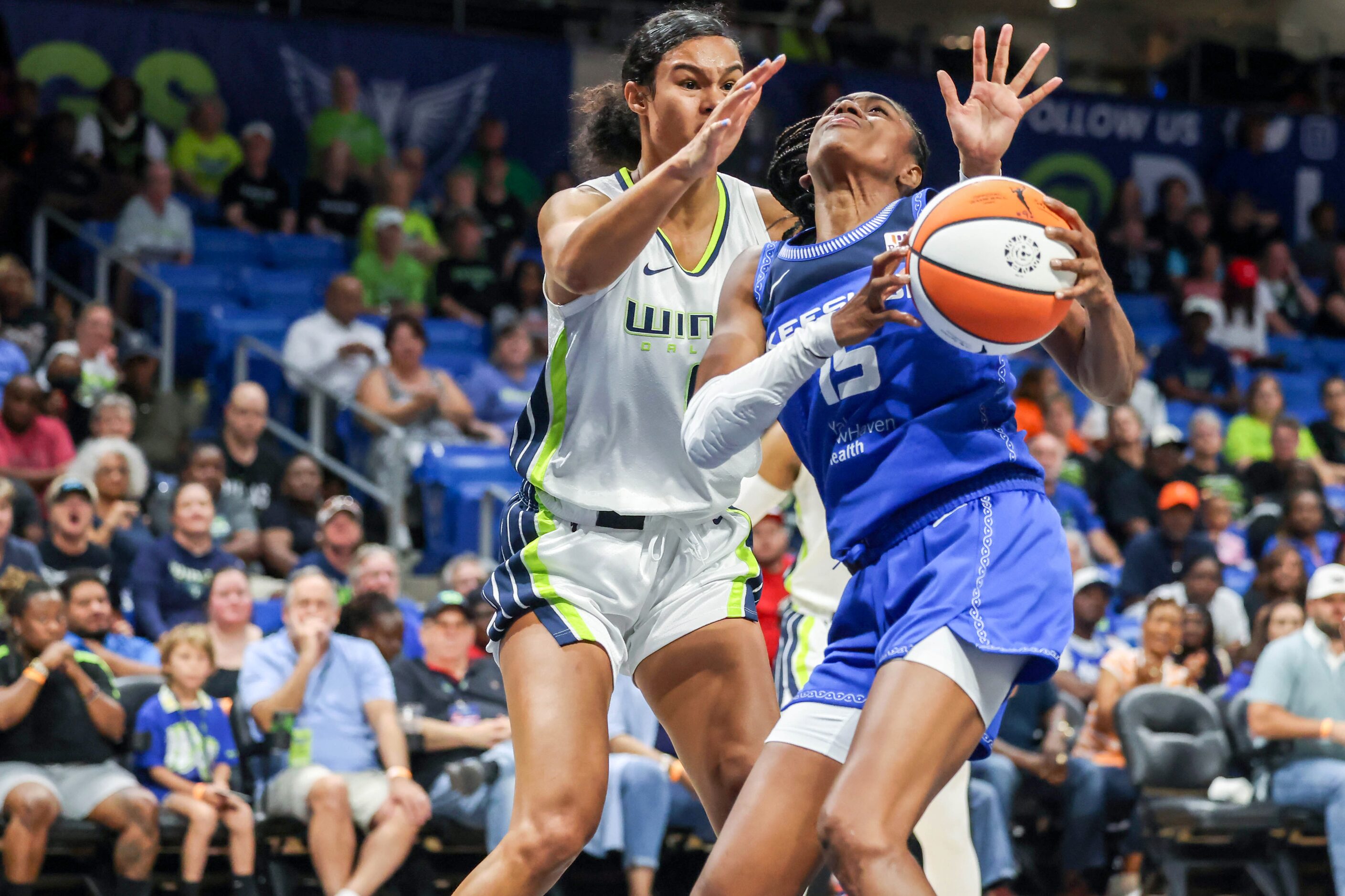 Dallas Wings forward Satou Sabally (0) attempts to guard Connecticut Sun guard Tiffany Hayes...