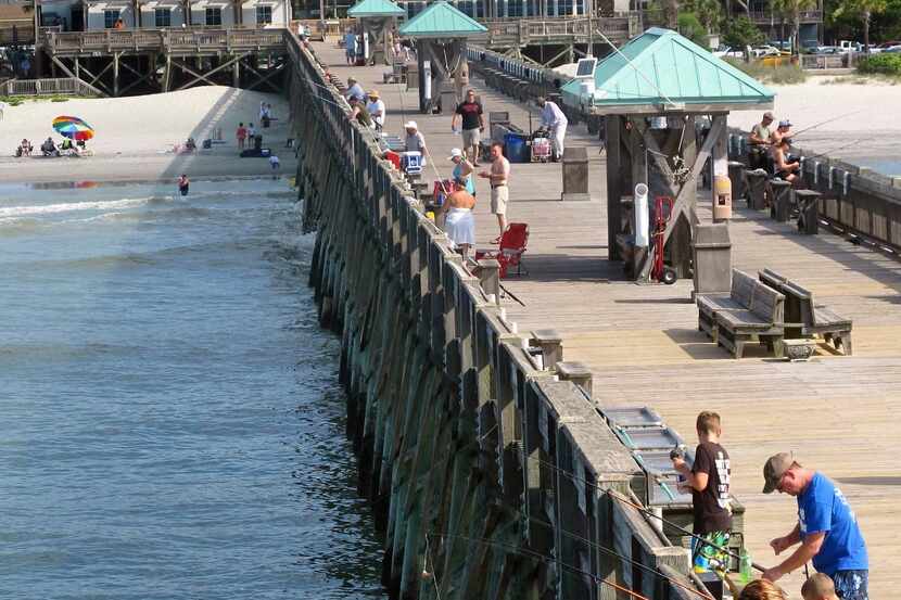 
 Fishermen try their luck on the pier at Folly Beach, S.C., near Charleston. Southwest...