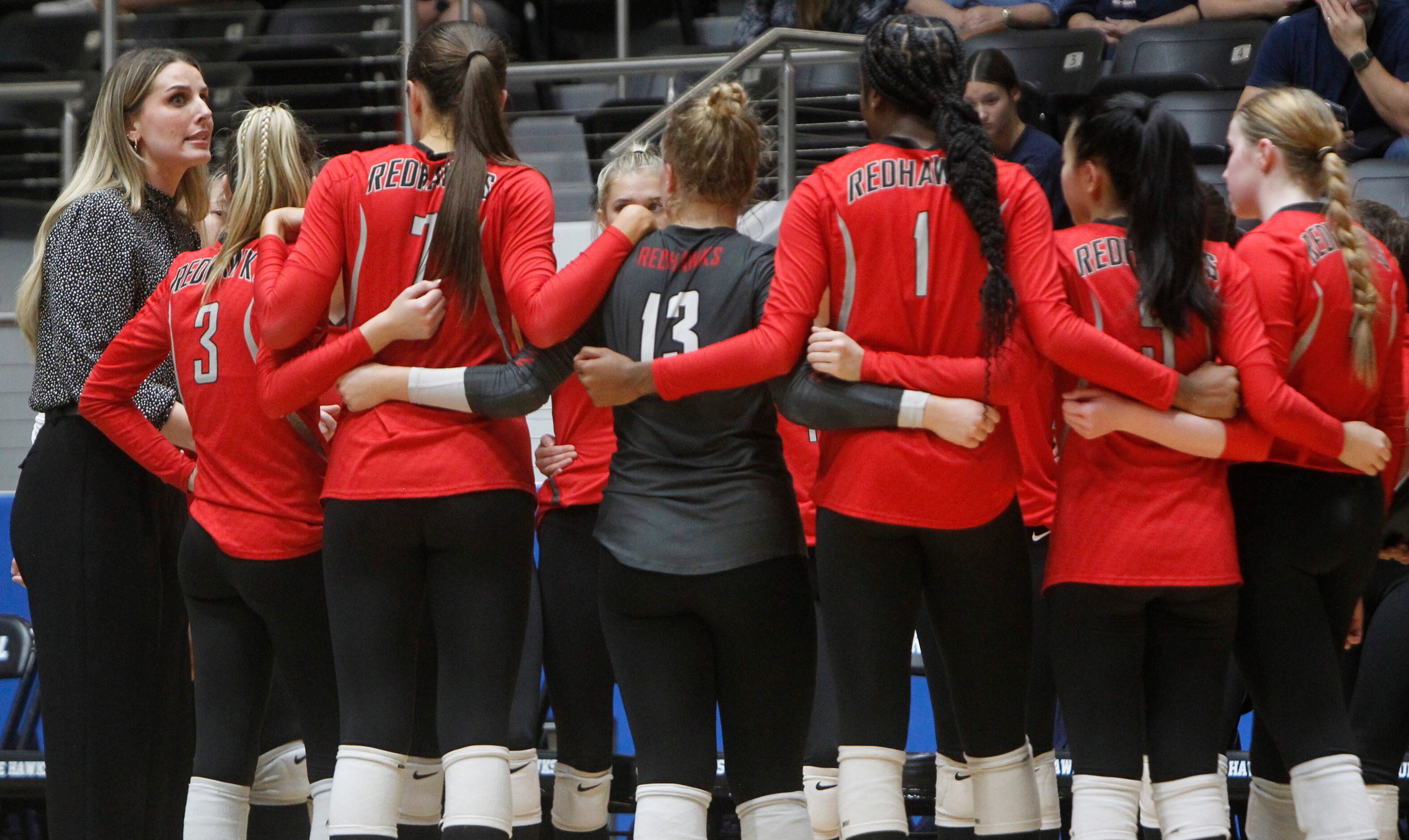 Frisco Liberty head coach Eighmy Dobbins, left, speaks with her team prior to the start of...