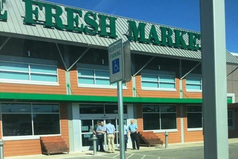  Employees standing outside The Fresh Market in Lakewood at Gaston Ave. and Garland Road on...