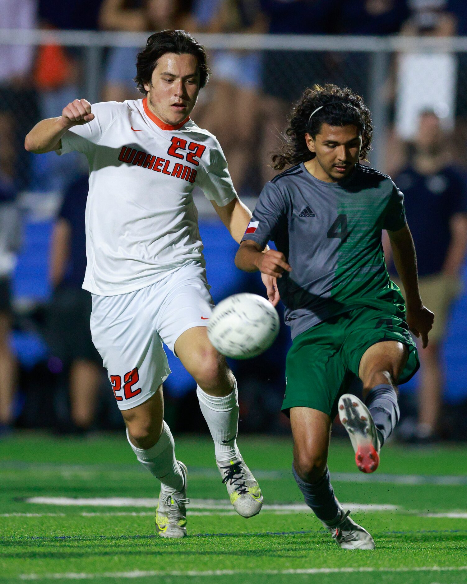 Fort Worth Trimble Tech Defender Leo Mireles (4) clears the ball away from Frisco Wakeland...