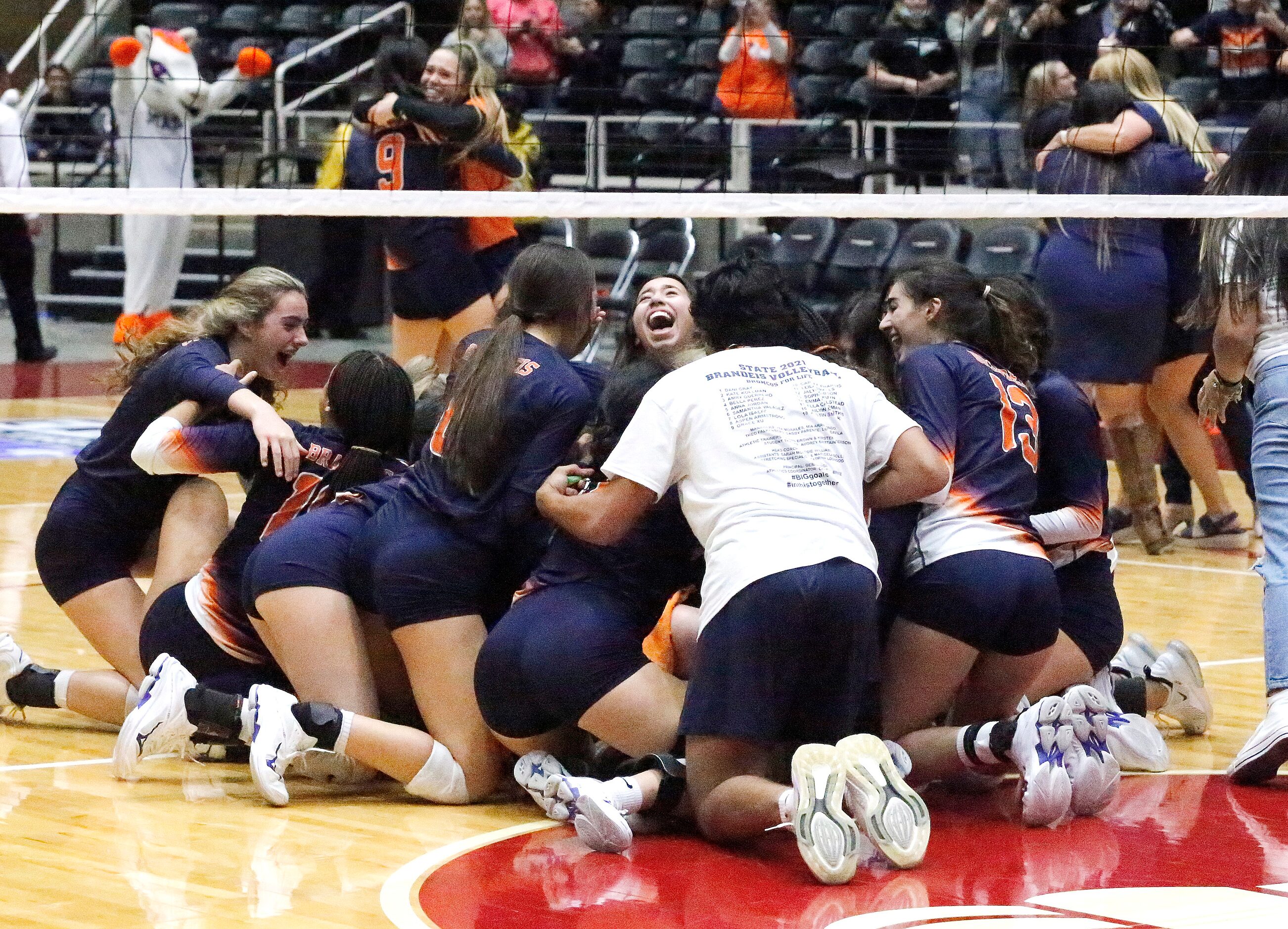 Northside Brandeis High School celebrates their five set victory as Keller High School...