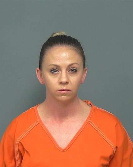 Amber Guyger, 30, was booked into the Mesquite Jail on Friday and quickly released on bond.