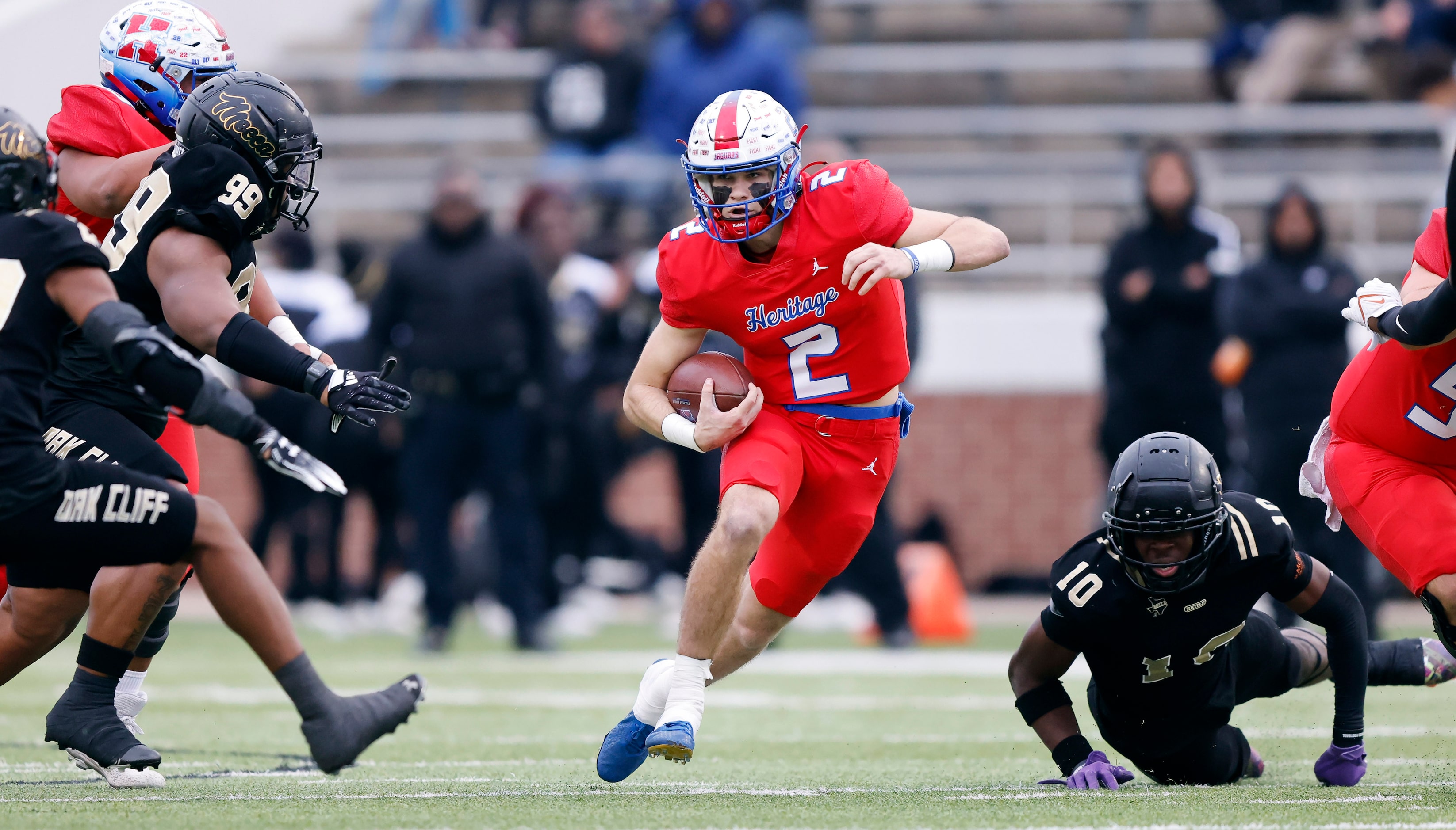 Midlothian Heritage quarterback Kaden Brown (2) keeps the ball during a first half run...