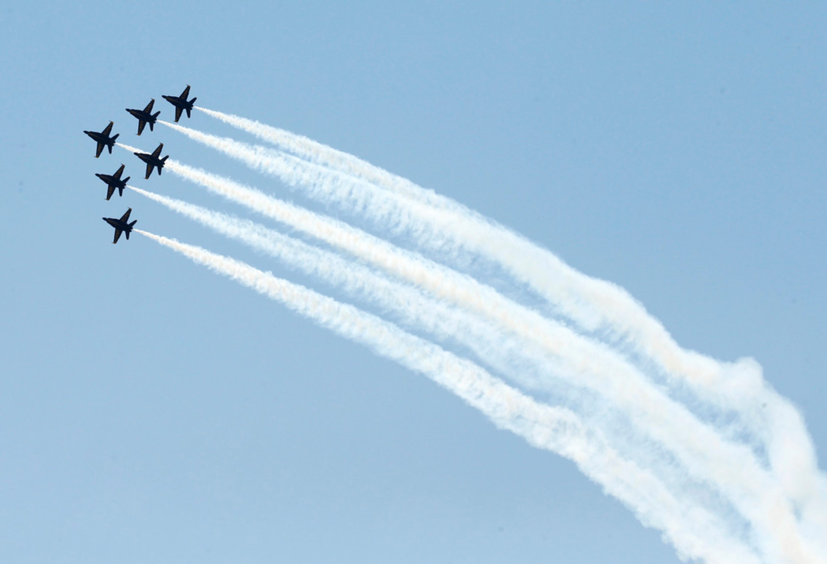 The U.S. Navy Blue Angels fly over downtown Dallas during the "America Strong" flyover event...