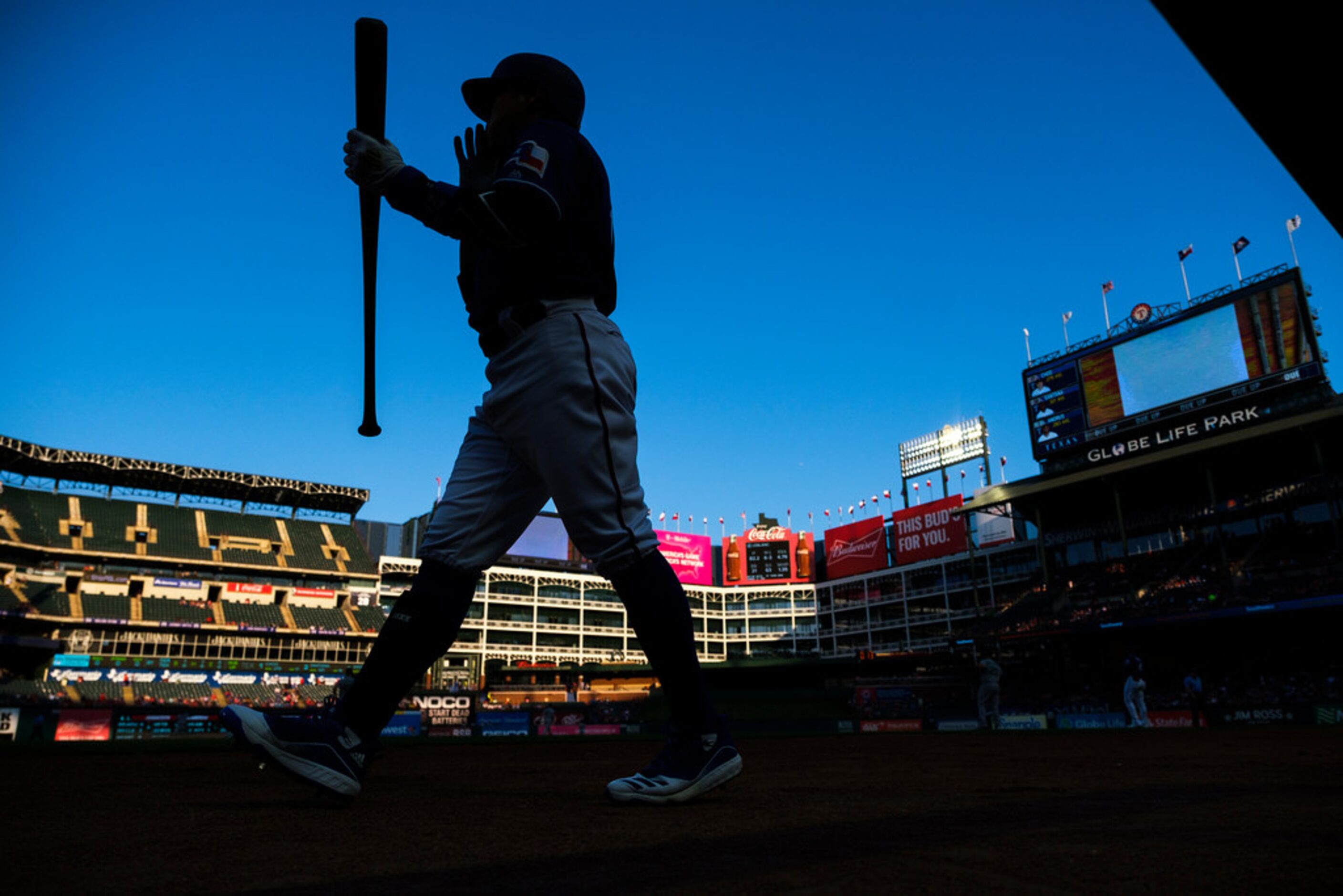 Texas Rangers right fielder Shin-Soo Choo heads for the plat to bat during the first inning...