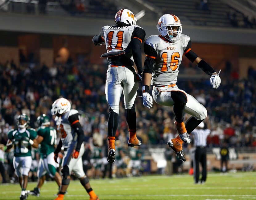 Lancaster receiver Nick Harvey (11) is congratulated with a body bump from Daeshon Hall (16)...