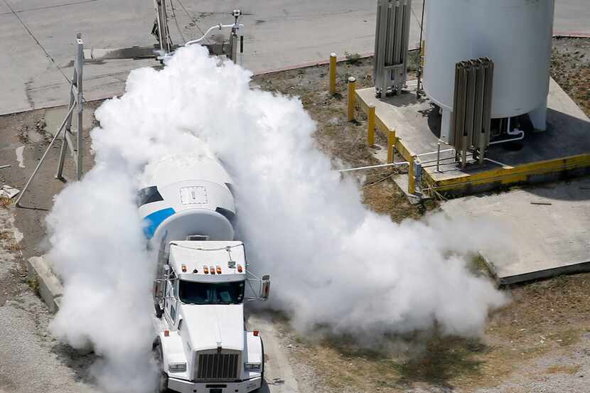 Liquid nitrogen is inserted into a Martin Marietta concrete truck to cool the load to the...