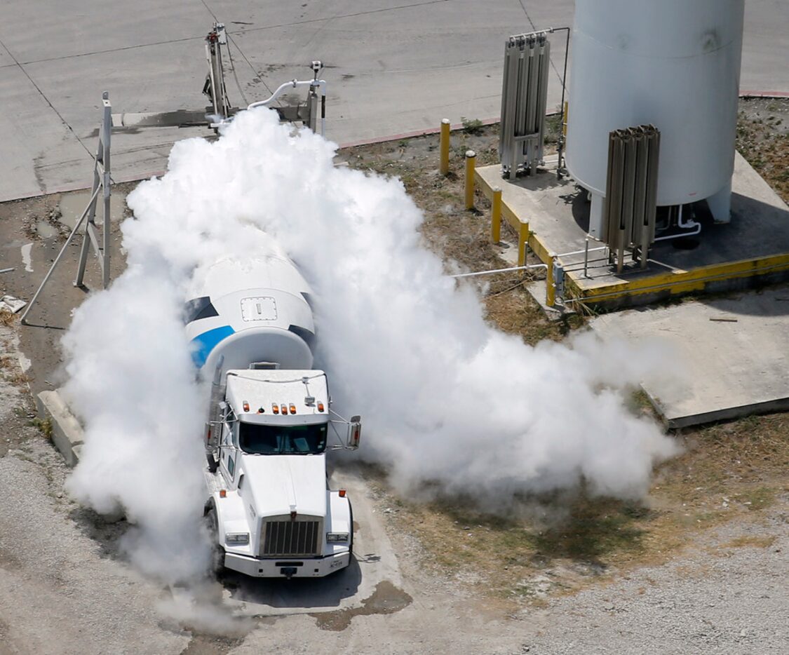 Liquid nitrogen is inserted into a Martin Marietta concrete truck to cool the load to the...