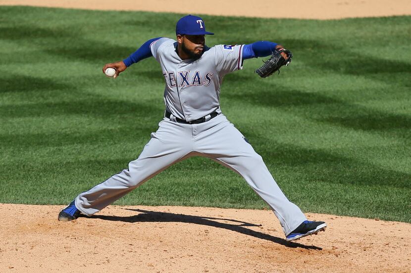DENVER, CO - AUGUST 9:  Relief pitcher Jeremy Jeffress #23 of the Texas Rangers delivers to...