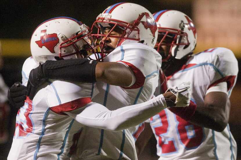 (left to right) Skyline's Cedric Collins is congratulated by his teammate Domenic Spencer...