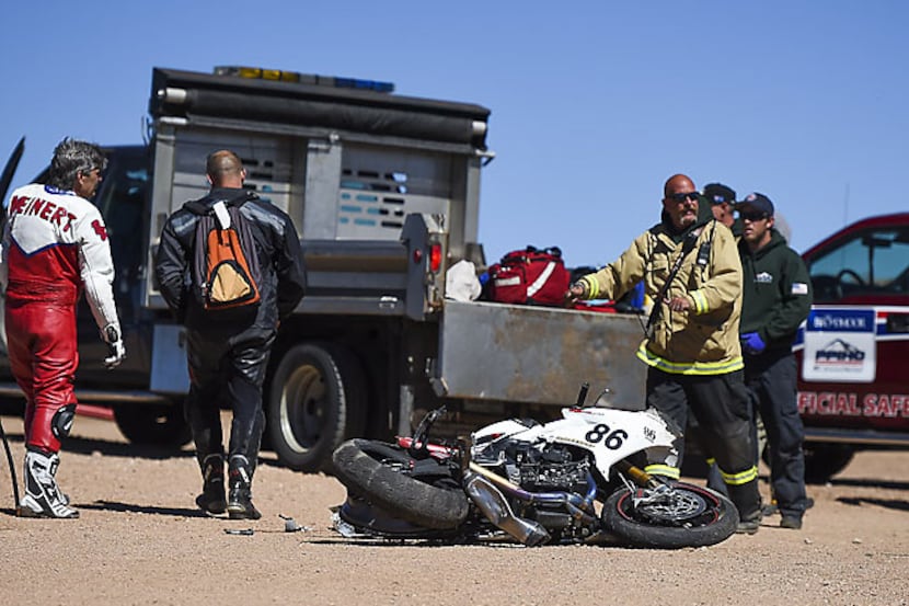 Middleweight racer Bobby Goodin's motorcycle lies in a parking lot Sunday near the finish...
