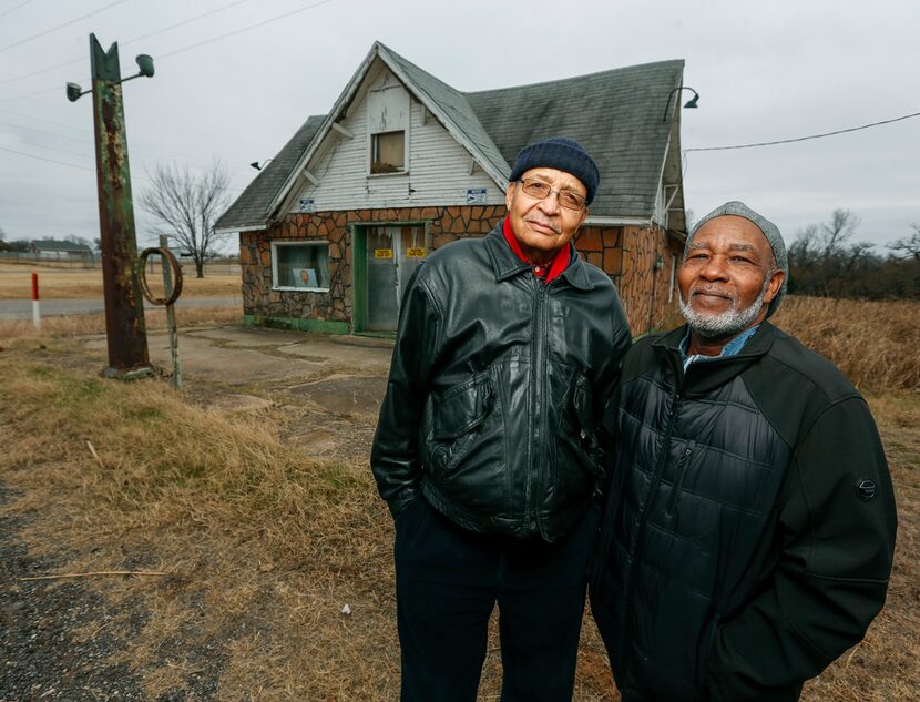 The Rev. Allen Threatt III (left) and his cousin Edward Threatt stand outside the Threatt...