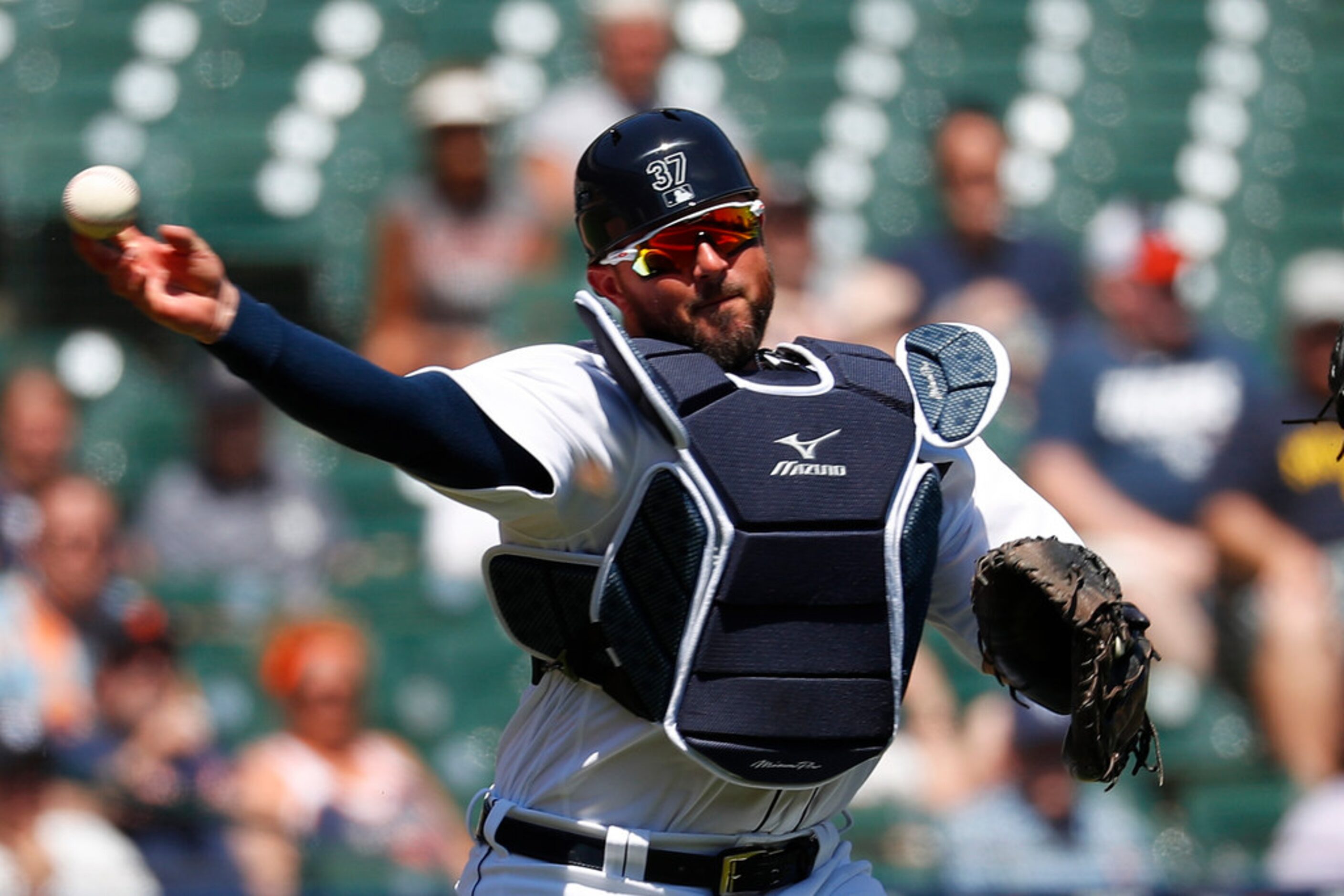 Detroit Tigers catcher Bobby Wilson throws to first base for an out on a Texas Rangers' Tim...