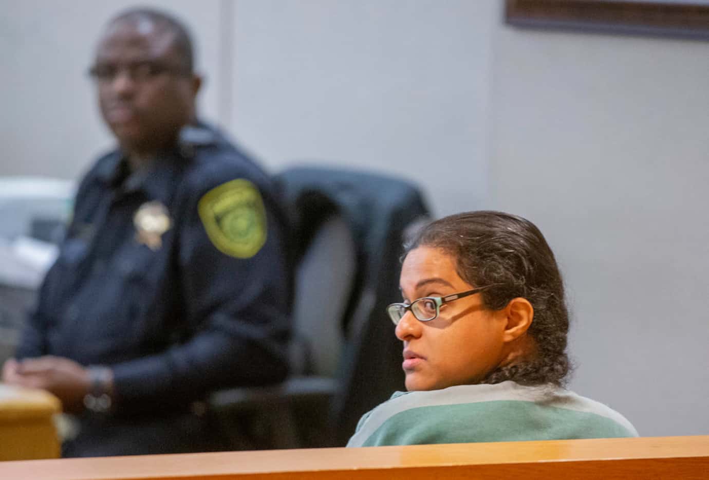 Sini Mathews looked behind her in the courtroom after a bond reduction hearing at the Frank...