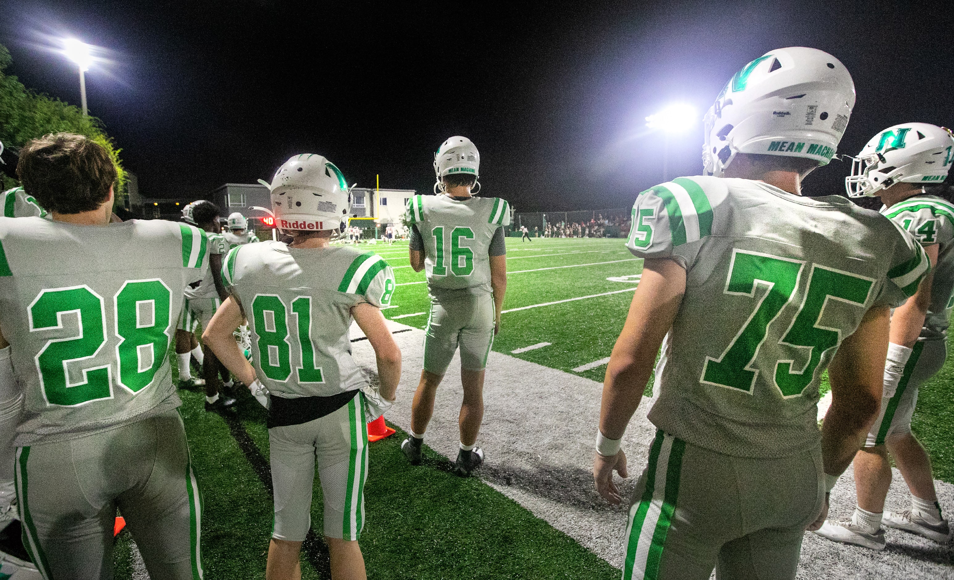 Arch Manning watches the action from the sideline as Newman High School takes on Riverside...