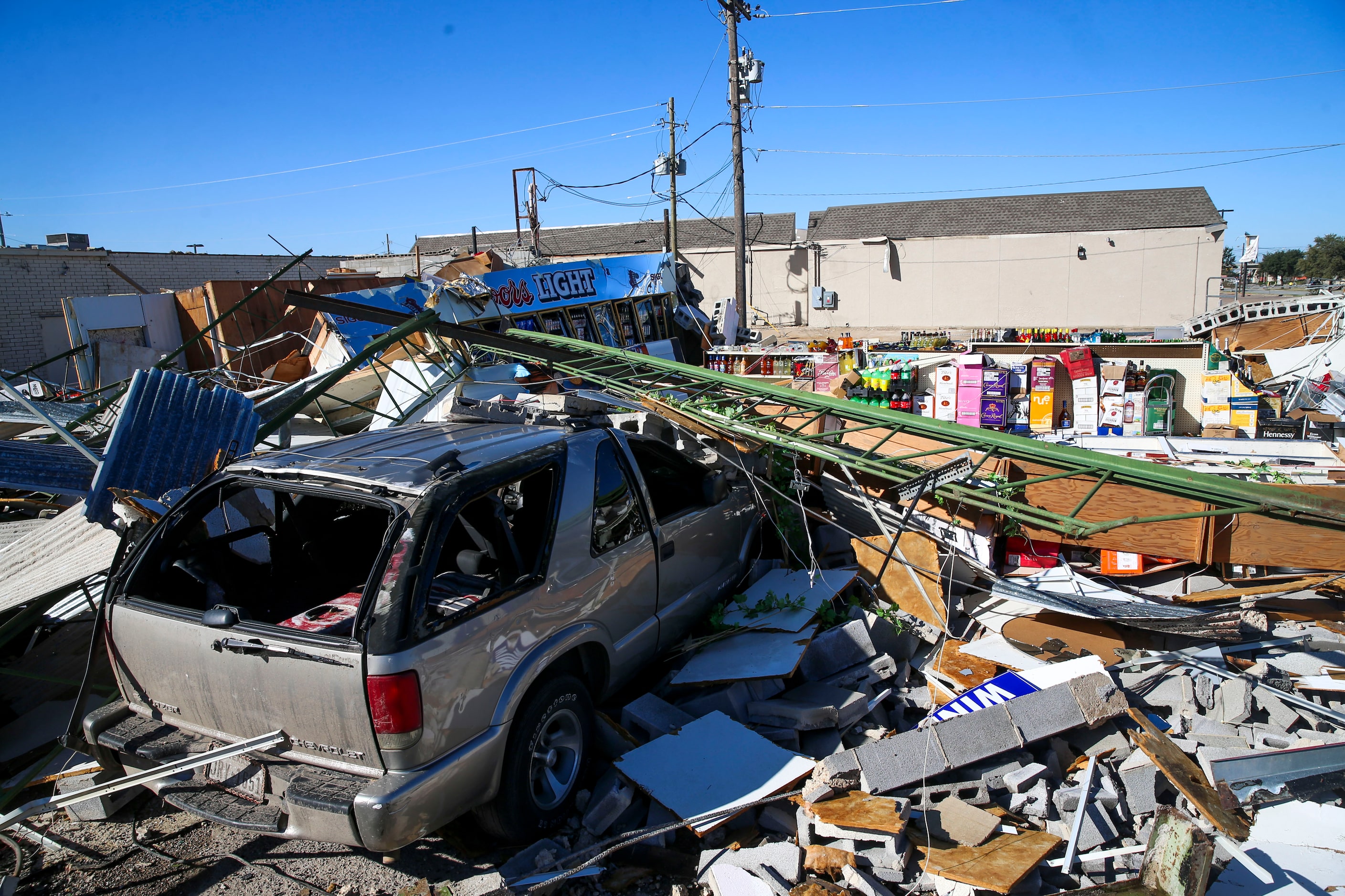 People work on clearing tornado debris on Monday, October 21, 2019 on Walnut Hill Lane in...