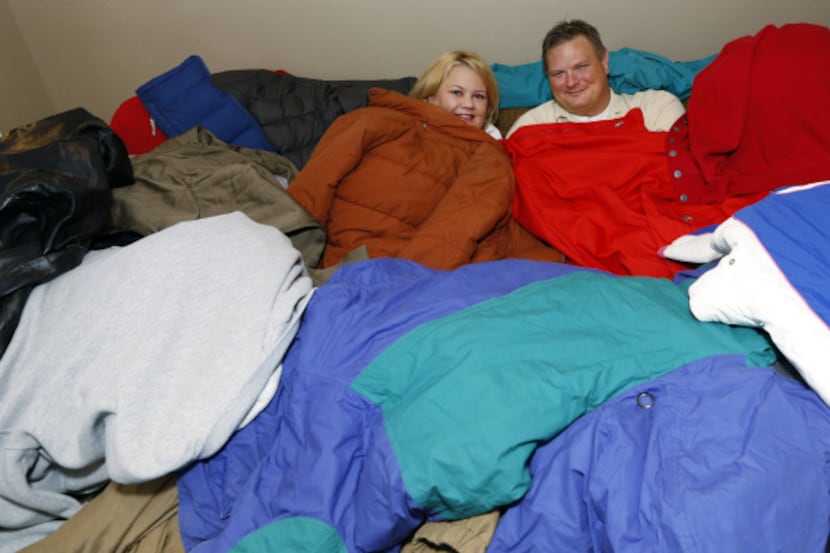 Andrea Anglin and Mike Bulin pile up the coats for teenagers who are on their own after...