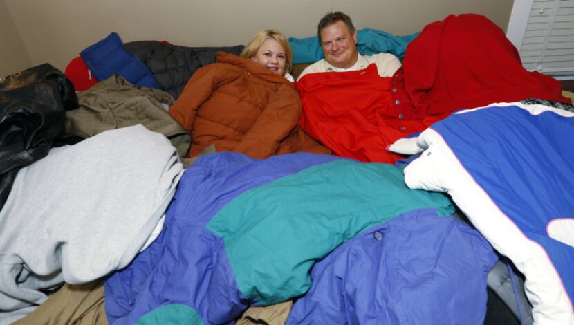 Andrea Anglin and Mike Bulin pile up the coats for teenagers who are on their own after...