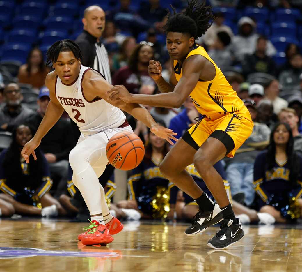 Oak Cliff Faith Family's Tahsheim Gary (5) tries to steal the ball from Silsbee's Dre’lon...