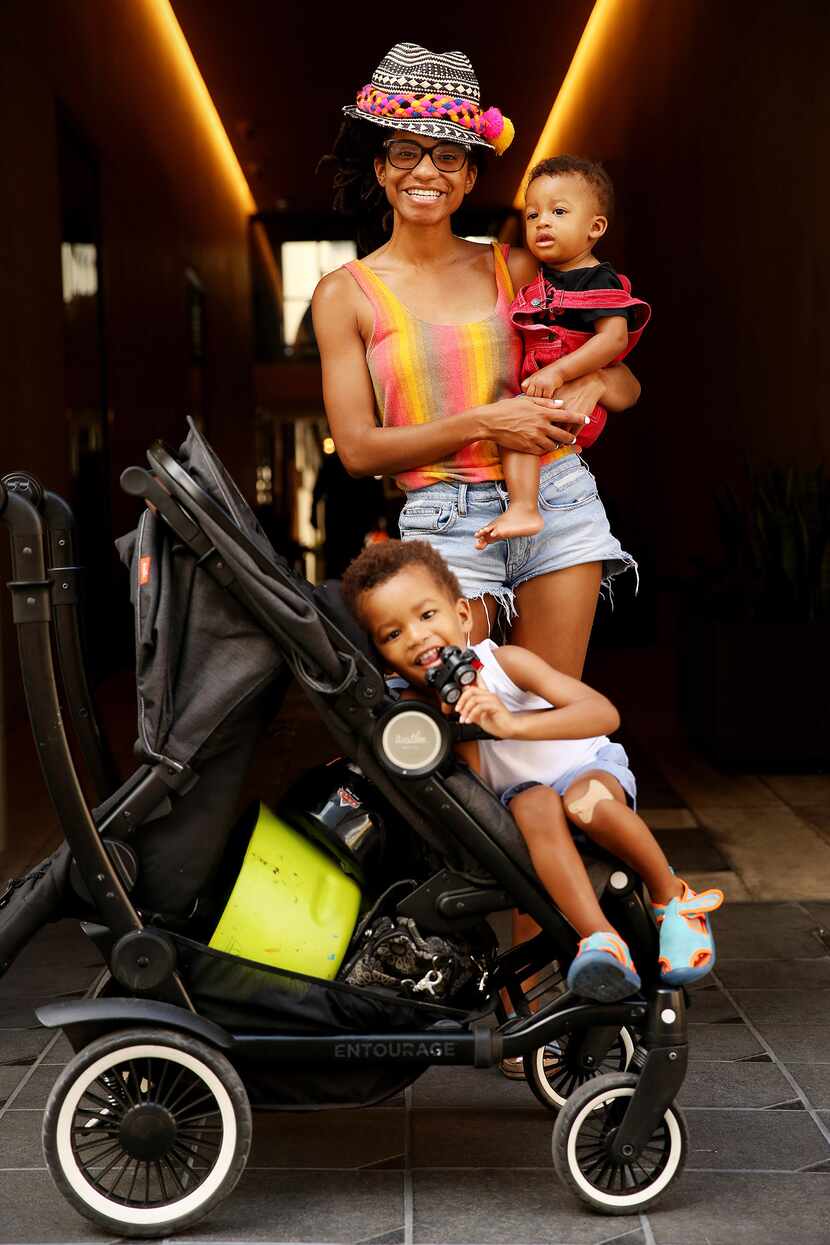 Kenya MomPremier of Dallas holds her son Kemet MomPremier, nine months old, while her other...