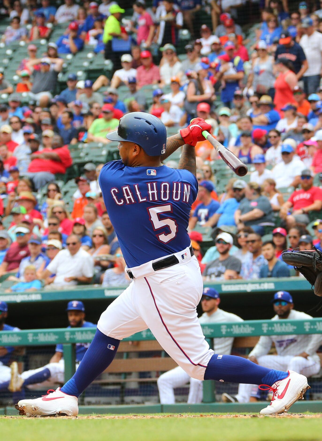 ARLINGTON, TX - JULY 14: Willie Calhoun #5 of the Texas Rangers hits a single in the first...