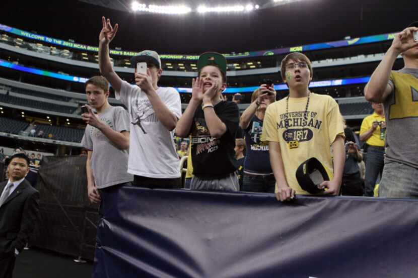 University of Michigan fans yelled to the players after the South Region Final at Cowboys...