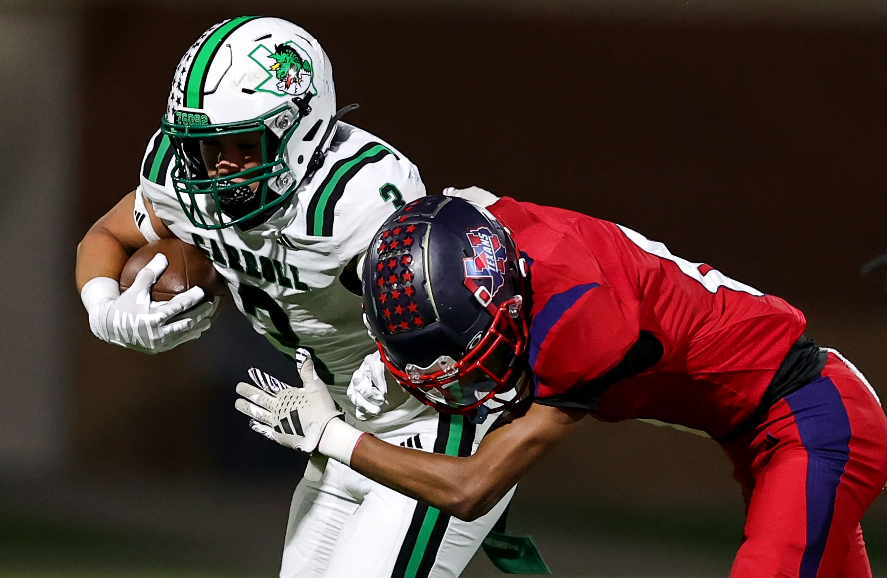 Southlake Carroll running back Davis Penn (3) tries to break free from Justin Northwest...