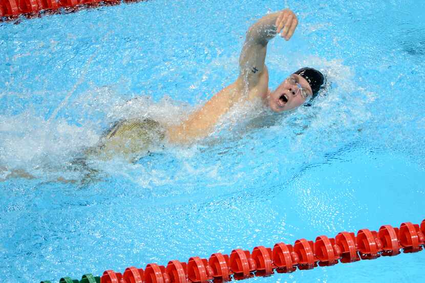 USA's Dennis Bowsher competes in the 200 meter swim portion of the modern pentathlon at...