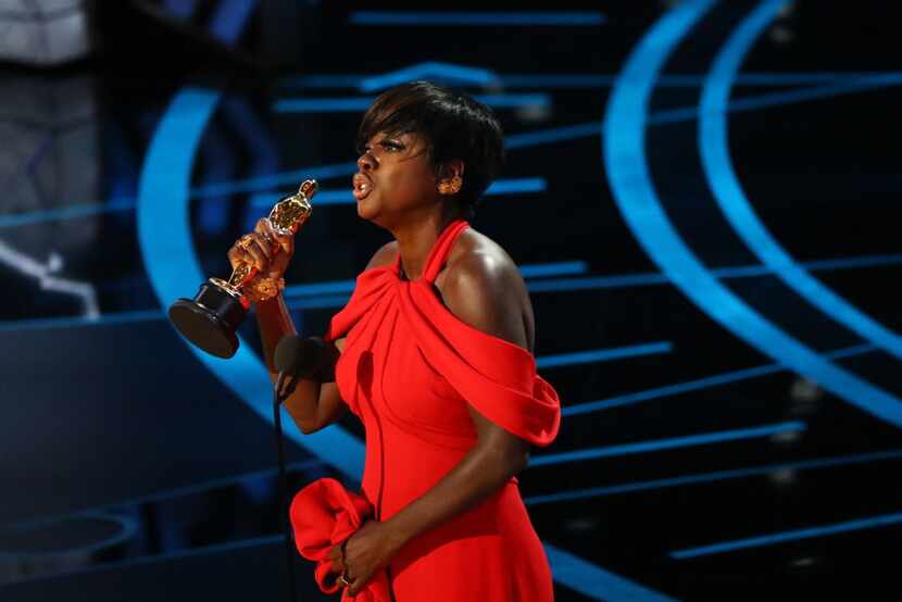 Viola Davis accepts the Oscar for best actress in a supporting role for her performance in...