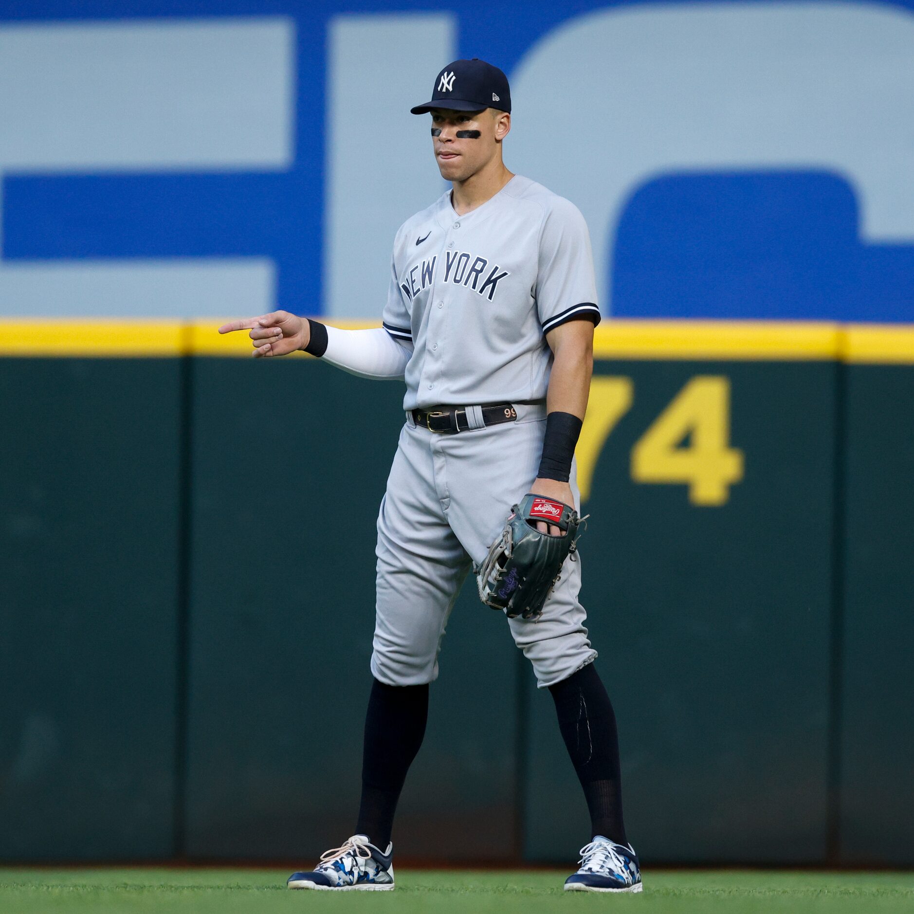 New York Yankees right fielder Aaron Judge (99) signals to a teammate during the first...