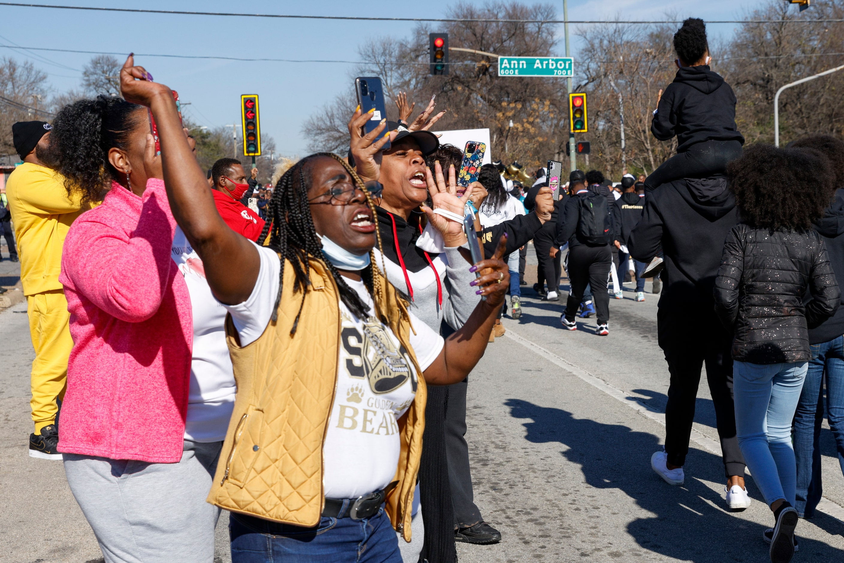 Community members cheer during a parade celebrating South Oak Cliff’s 2021 UIL Class 5A...