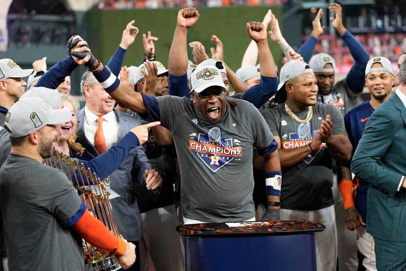 Houston Astros manager Dusty Baker Jr. and the Houston Astros celebrate their 4-1 World...
