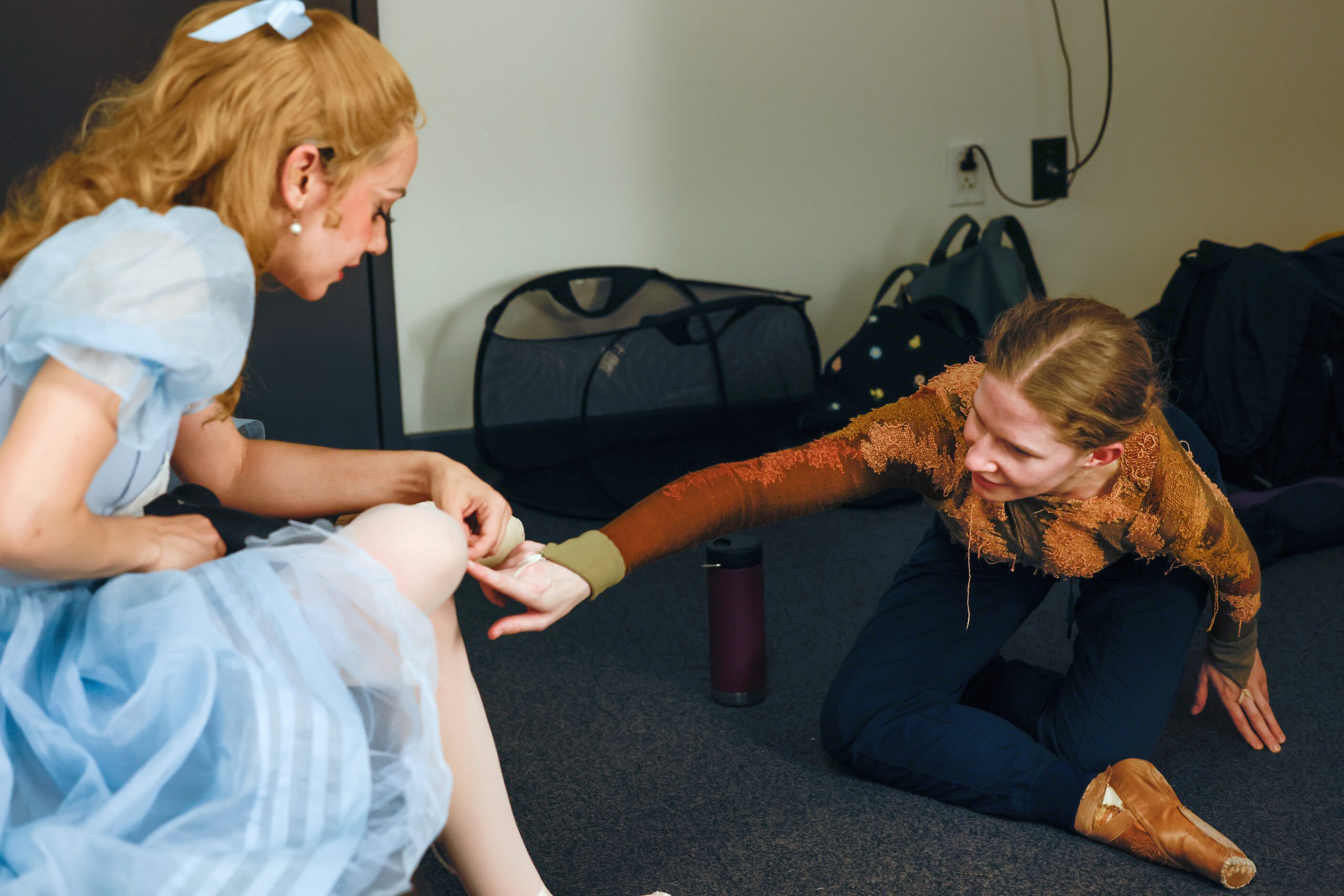 Alexandra F. Light (left) talks with Rayleigh Vendt in their dressing room between acts of a...