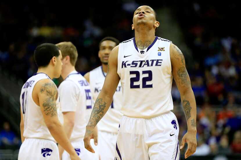 KANSAS CITY, MO - MARCH 15: Rodney McGruder #22 of the Kansas State Wildcats reacts after...