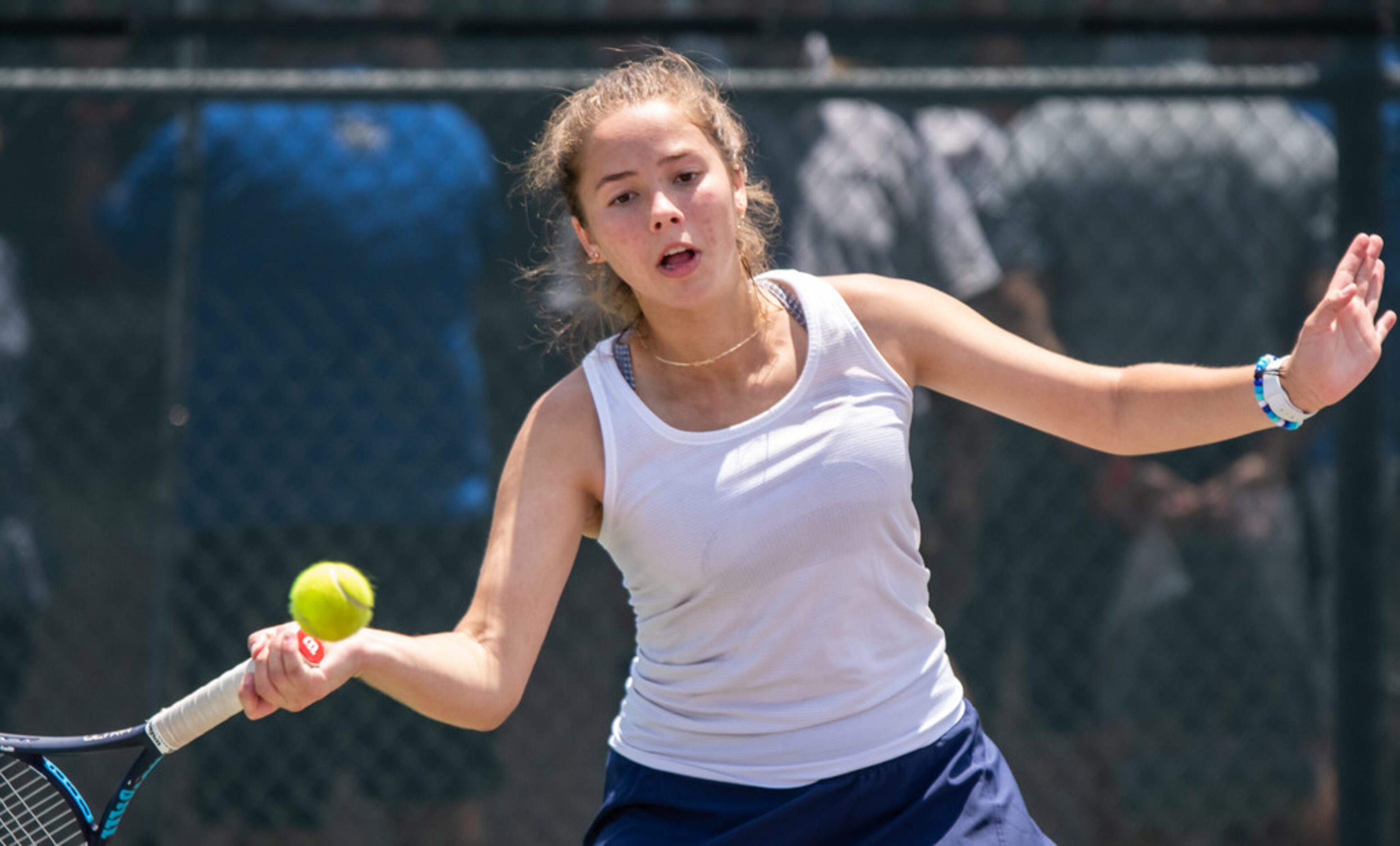 Highland Park's Ashlee Newton returns the ball in a doubles match with teammate Rhett Bailey...