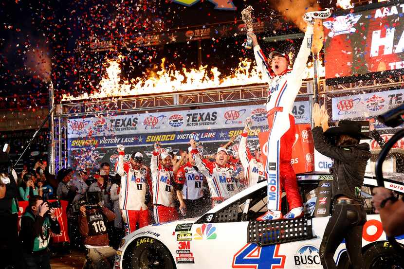 Kevin Harvick driving for Mobil 1 Ford celebrates winning the Monster Energy NASCAR Cup...