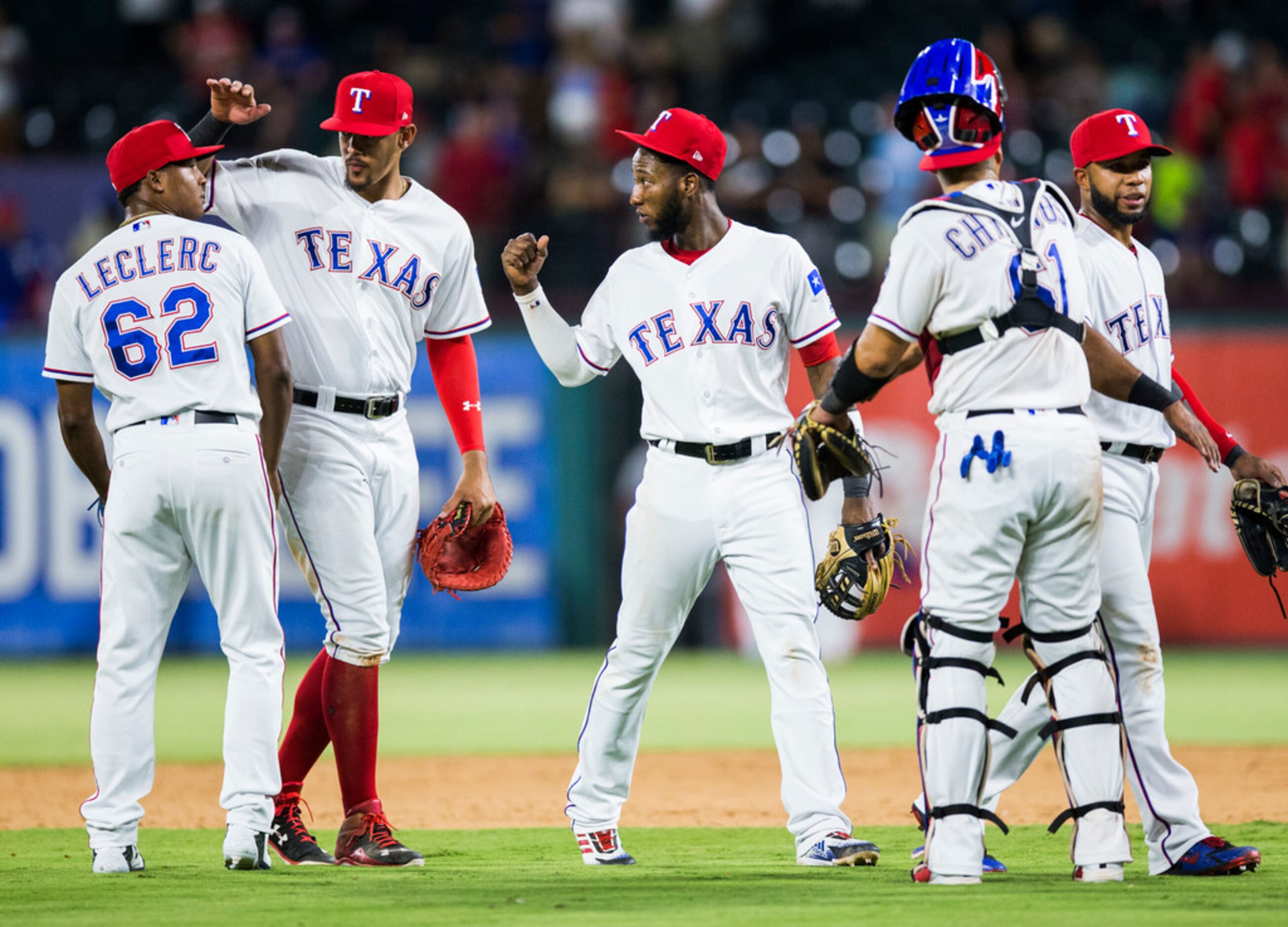 The Texas Rangers celebrate after an 8-6 win over the Los Angeles Angels on Thursday, August...