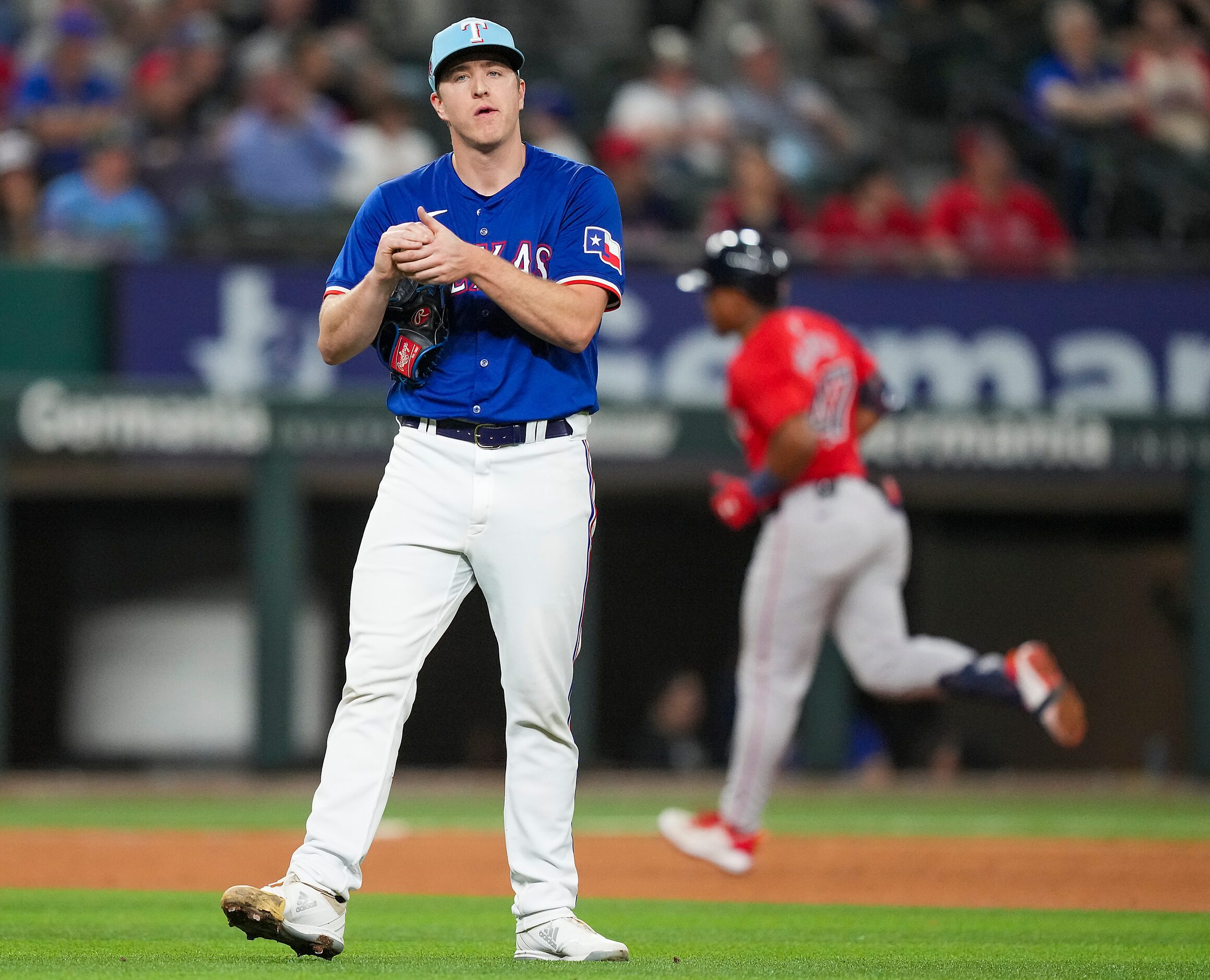 Texas Rangers pitcher Josh Sborz gets a new ball as Enmanuel Valdez of the Boston Red Sox...