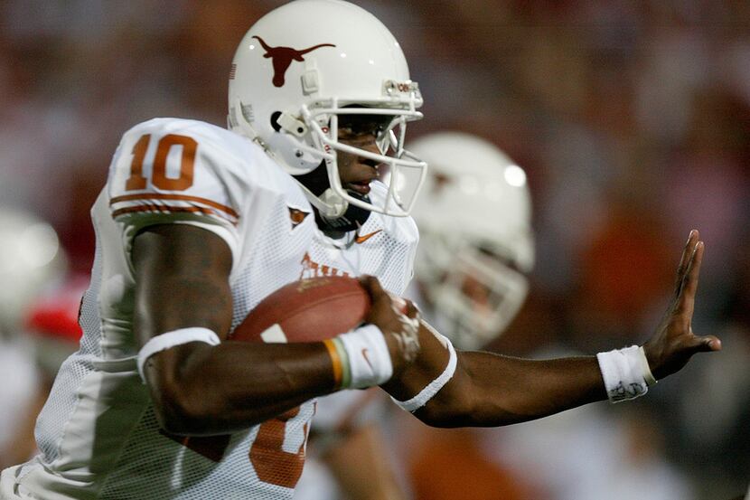 FILE - In this Sept. 10, 2005, file photo, Texas's quarterback Vince Young (10) runs against...