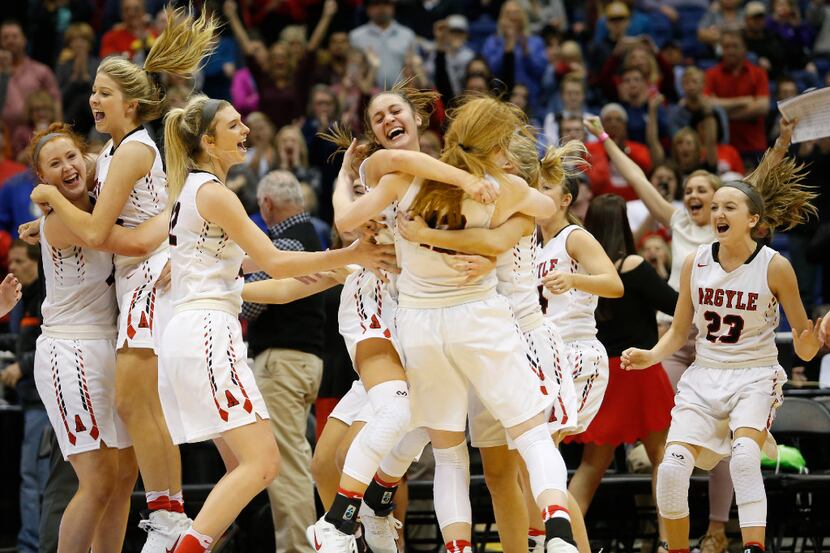 Argyle celebrates a 40-30 win over Liberty Hill during the class 4A girls basketball UIL...