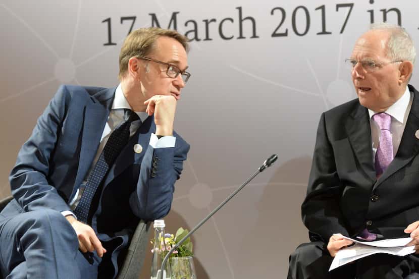 German Finance Minister Wolfgang Schaeuble, right, and the President of Deutsche Bundesbank,...